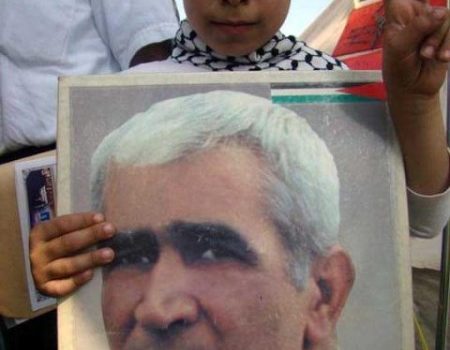 Palestinian child holding poster of Ahmad Sa'adat.